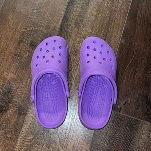 Purple crocs. Size says W 8-9